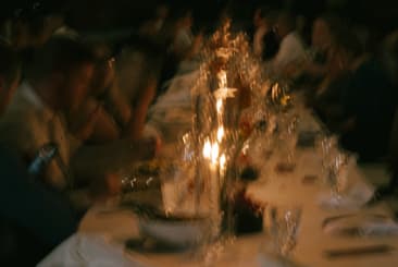 Candlelit reception dinner table with guests