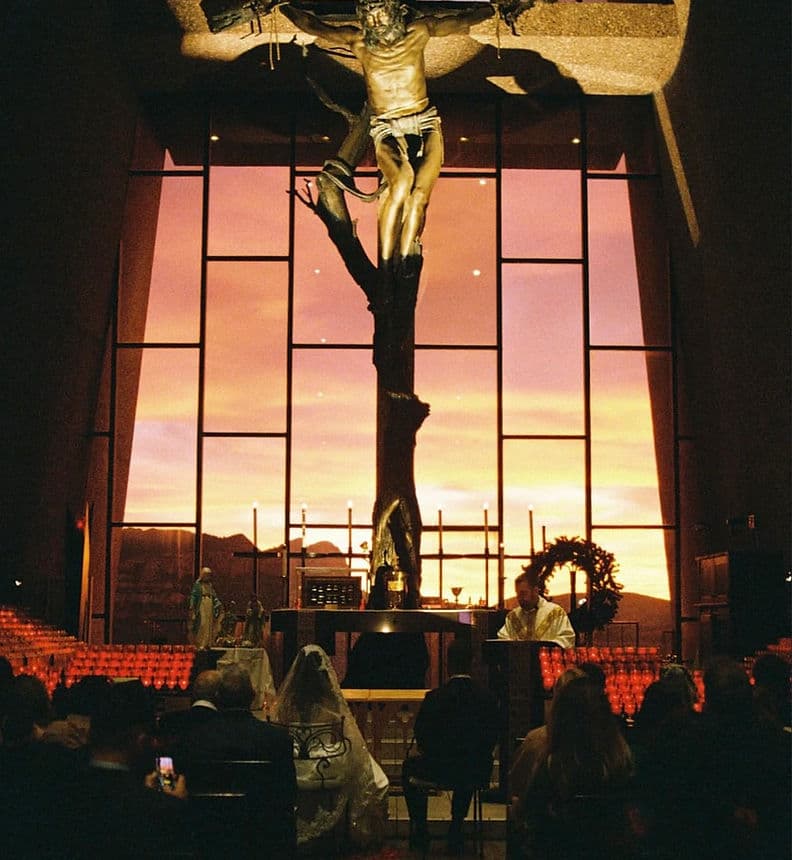 Wedding ceremony at sunset inside the Chapel of the Holy Cross in Sedona