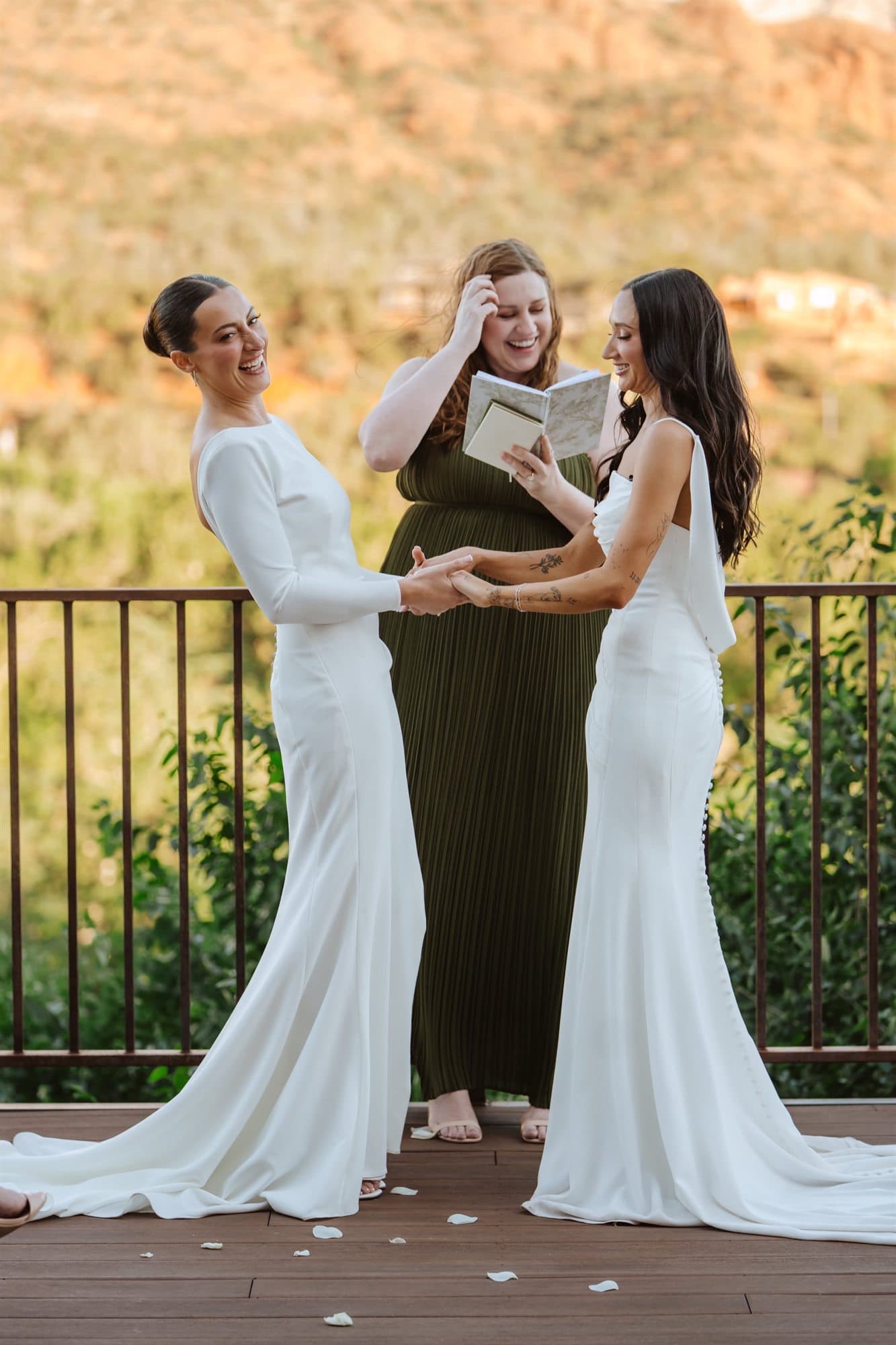 Laughing together during the ceremony with their officiant