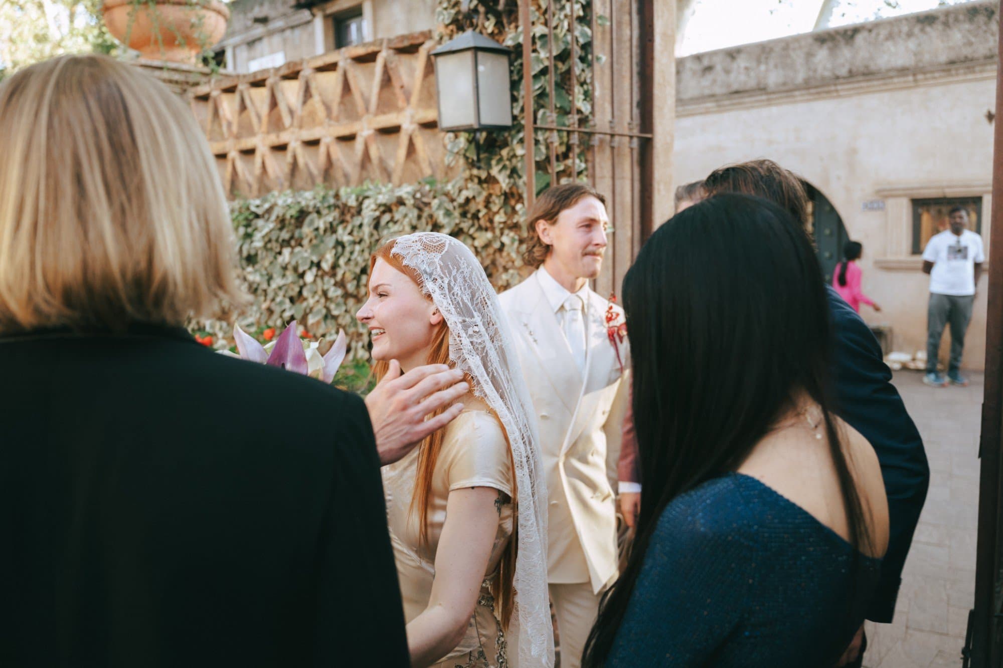 Guests greeting Jordan and Austin as they leave the ceremony