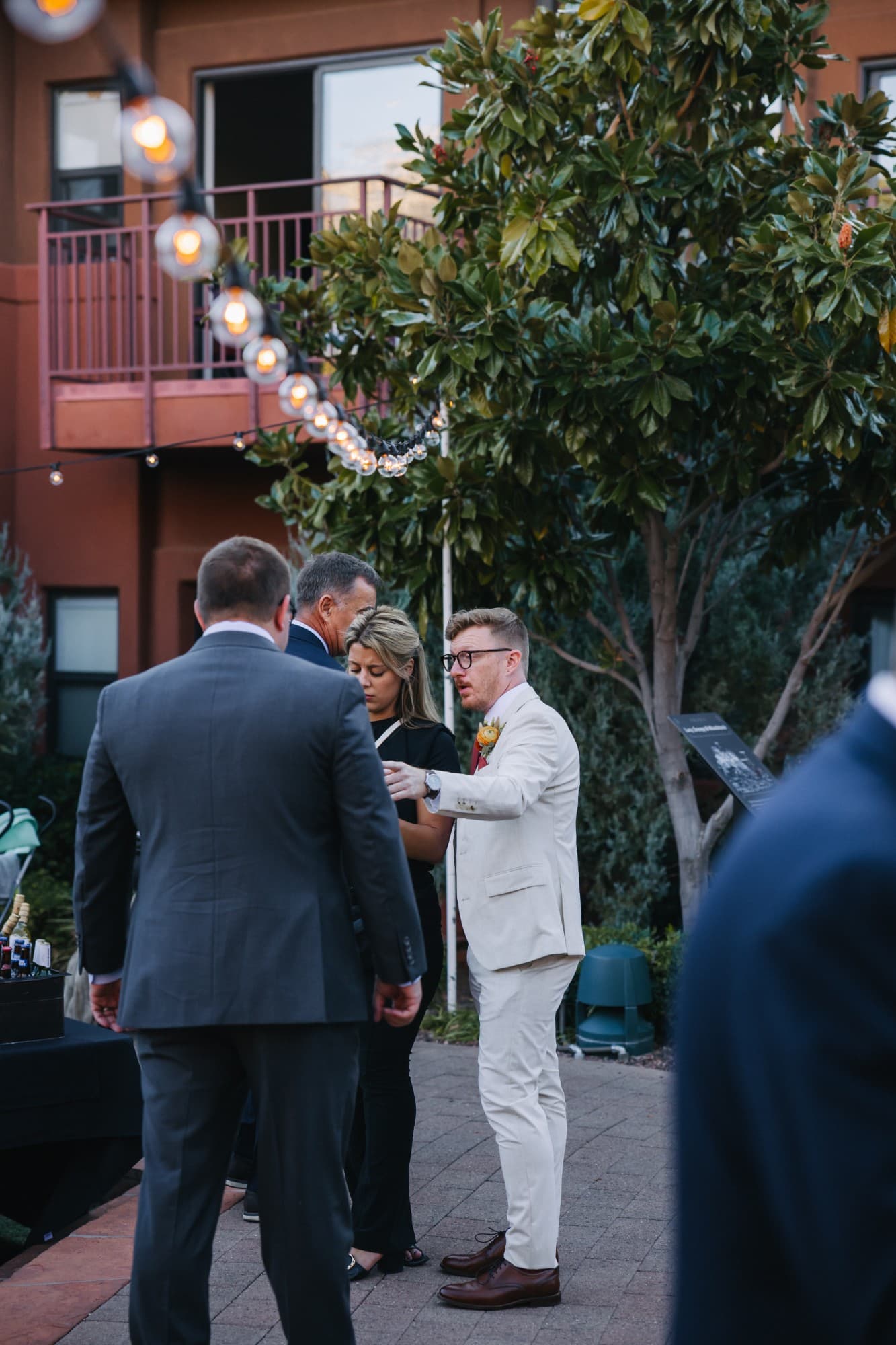 Arabella talking through the timeline with a groom and guests