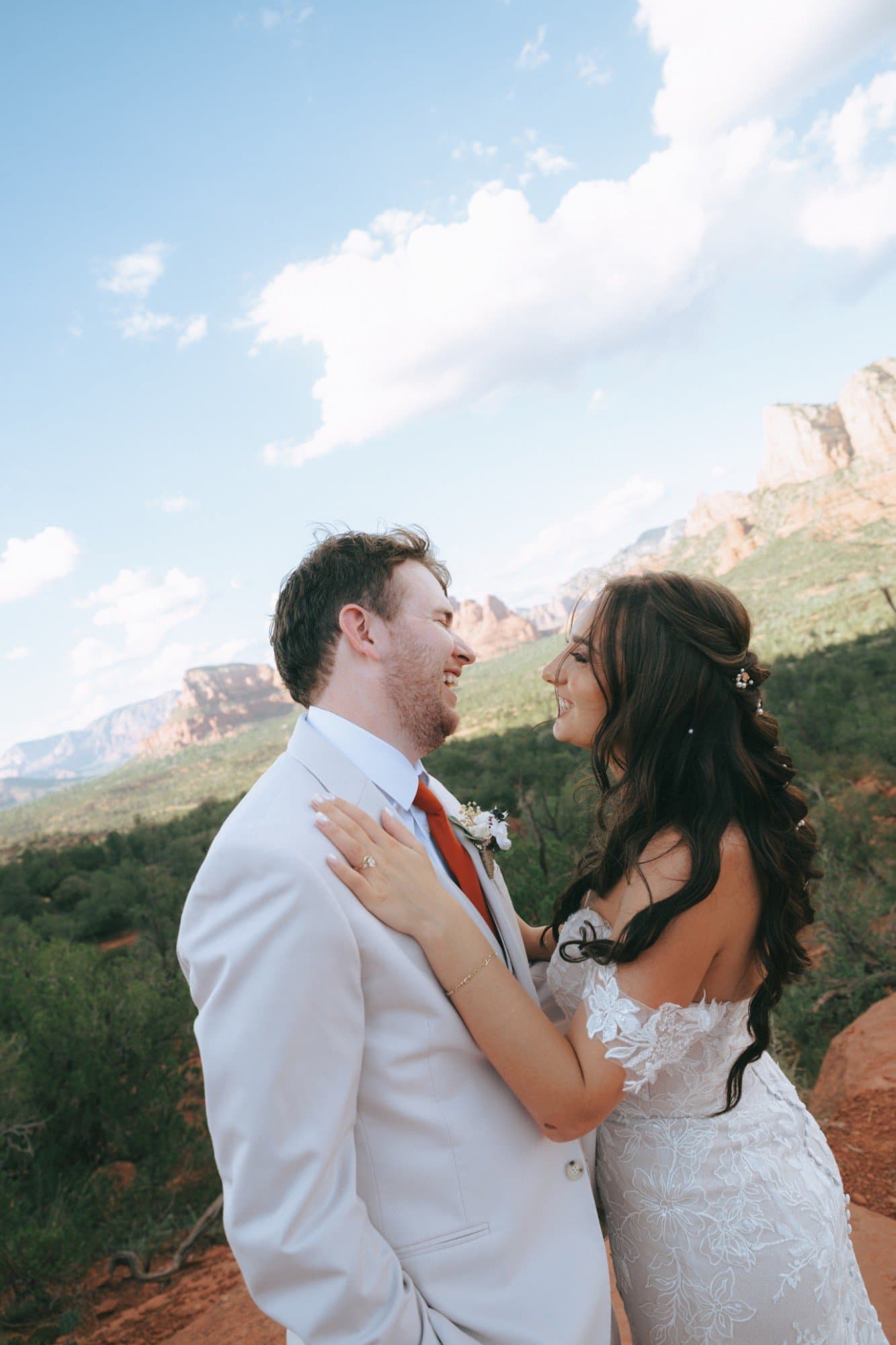 Kassie and Nathan laughing together above the Sedona valley