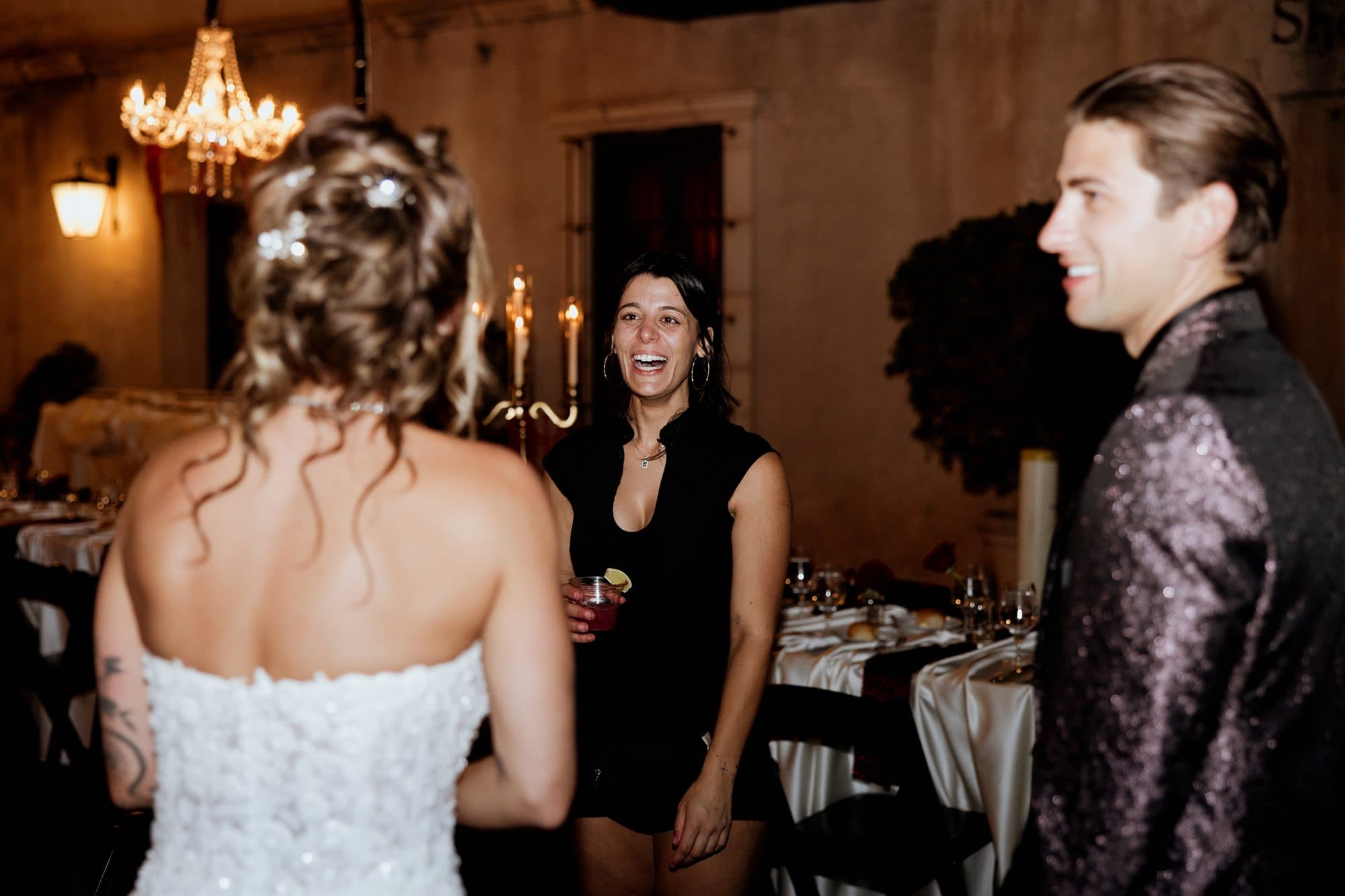 Sarah and Grant greeting their guests in the courtyard